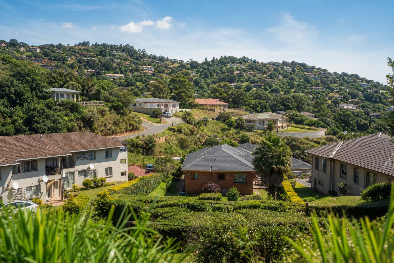 Sunny hillside residential neighbourhood in Mbabane, Eswatini under a clear blue sky